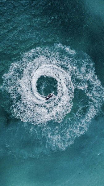 • “Realistic Ocean Wave Riding Boat Wallpaper – 4K Ultra HD Aesthetic