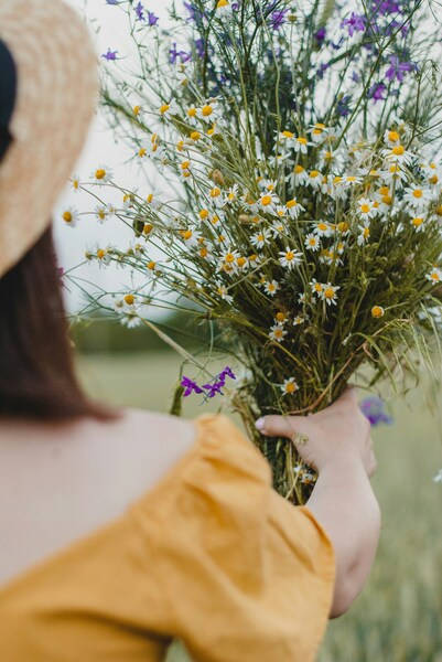 Person Holding Flowers