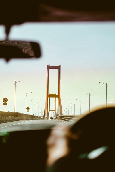 • ‘Driving Over a Bridge at Sunset – Aesthetic Car Wallpaper – 4K Ultra HD