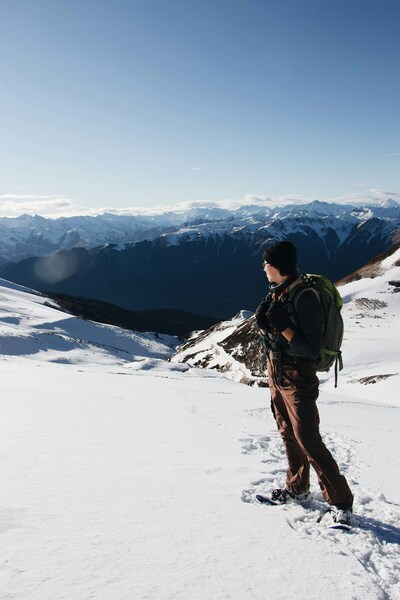 • Hiker on Mountain Peak Wallpaper – Nature Photography 4K Background