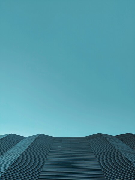 Minimalist Abstract Wallpaper – Vintage Geometric Design with a Blue Sky Ba