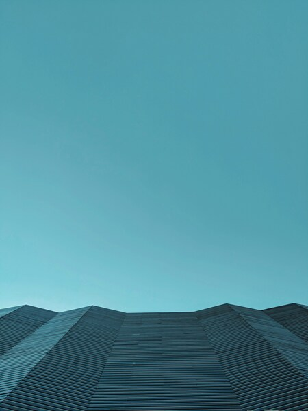 Minimalist Abstract Wallpaper – Vintage Geometric Design with a Blue Sky Ba
