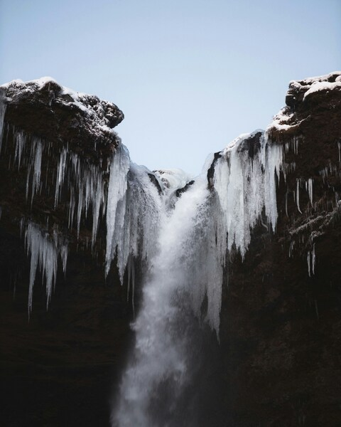 Waterfall with icicles: A serene, real-world landscape in stunning 4K and H